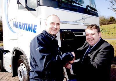 Maritime Transport driver Derek Drummond (left) was presented with the keys to his new Volvo FH by the company’s Liverpool Area Manager Brian McWhirter.)